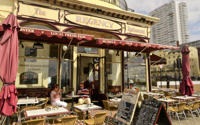 The historic Regency restaurant on Brighton seafront . Alfresco chairs and tables. Outdoor seating and alfresco dining opposite the i360. Seafront Restaurants