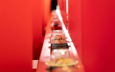 tray with red curtains around at Moshimo Japanese Sushi restaurant. Available for Brighton takeaway