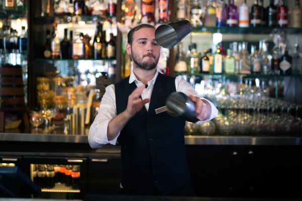 A bartender making cocktails at Brighton Metropole Bar. A Fringe food guide favourite