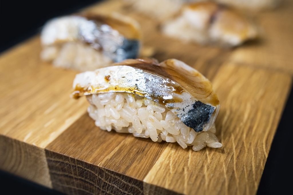 Fish and rice presented on a wooden board