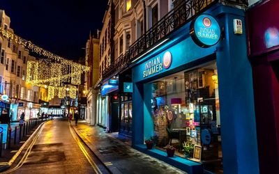 the blue facade of Indian Summer with twinkly lights in the background.