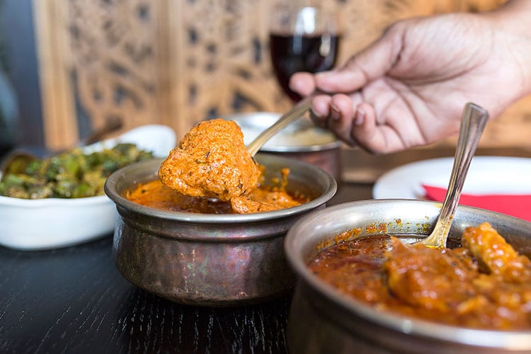 Chaula's Lewes - Serving creamy curry at Chaula's Lewes