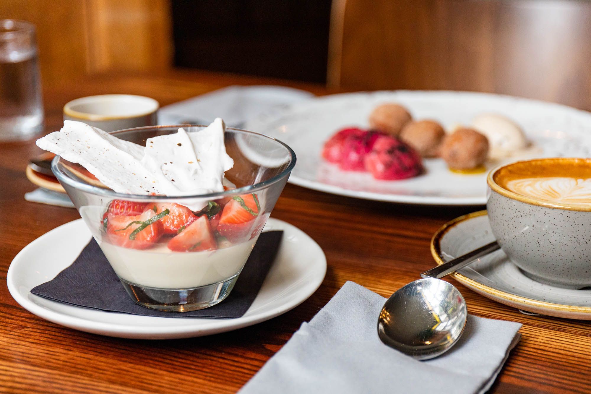 delicious looking dessert including strawberry pudding cake, a cup of coffee served as drink