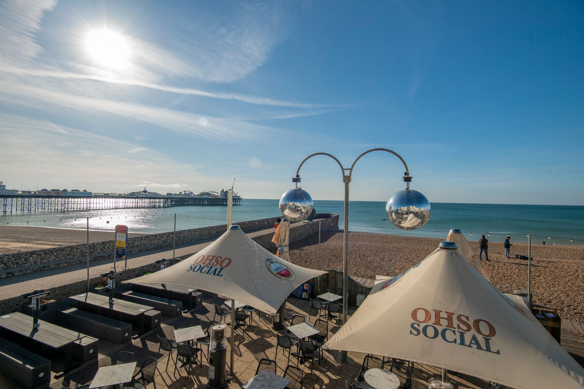outdoor seating area at the ohso social, sunny day and beach view