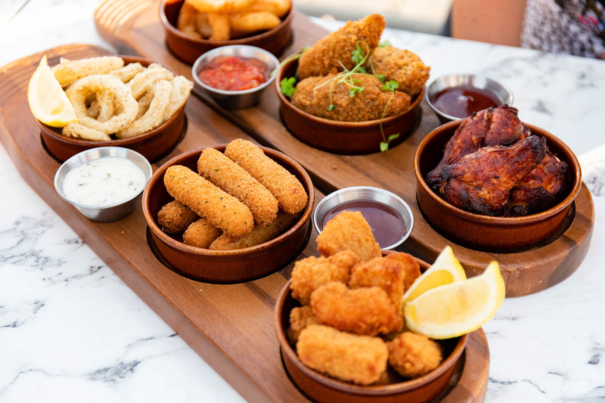 fried pieces of meat on the wooden board