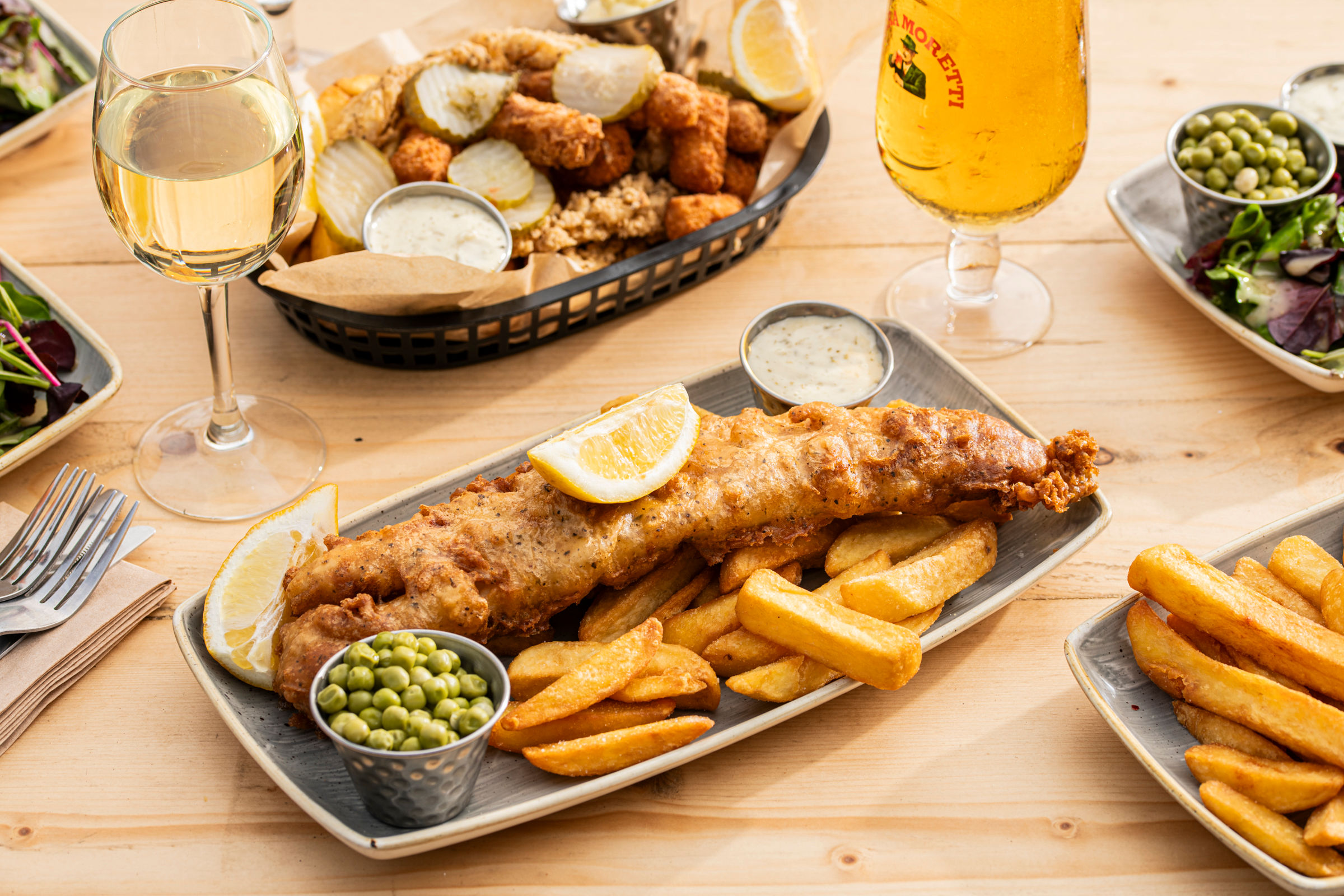 fish and chips dish served with beer at Ohso