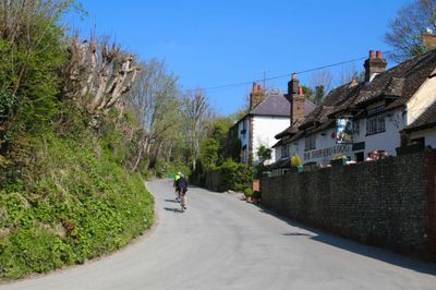 Cyclists riding along a country lane passed the pub on a bright Summers day