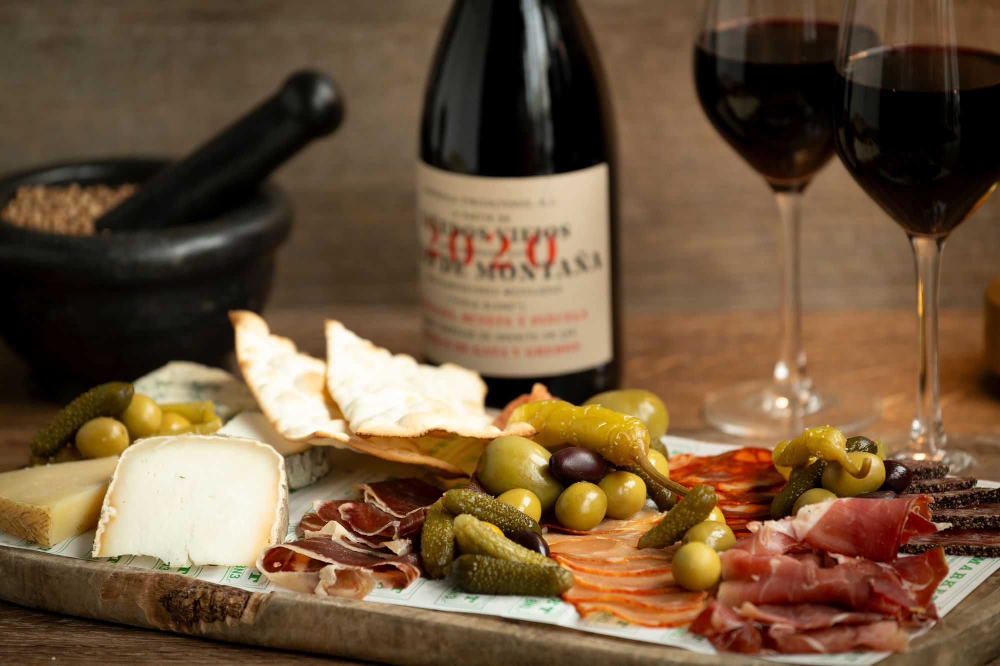 close up side shot of the charcuterie and cheese board served with red wine at the Marker Restaurant