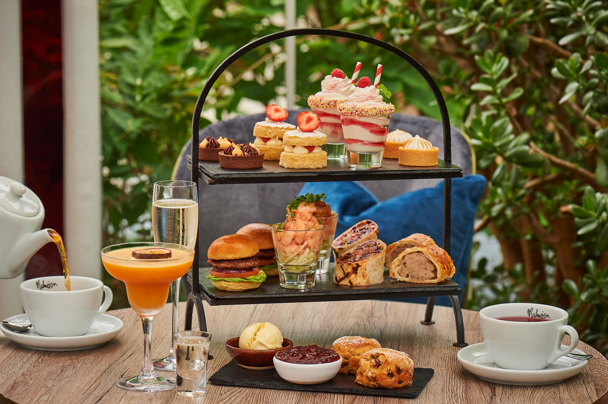 afternoon tea with various mini foods choices served at the table of Malmaison Brighton. 
