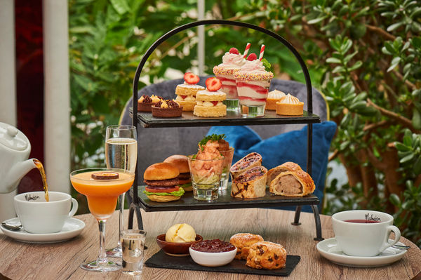 afternoon tea with various mini foods choices served at the table of Malmaison Brighton.