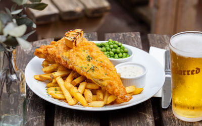 fish and chips served with sauces
