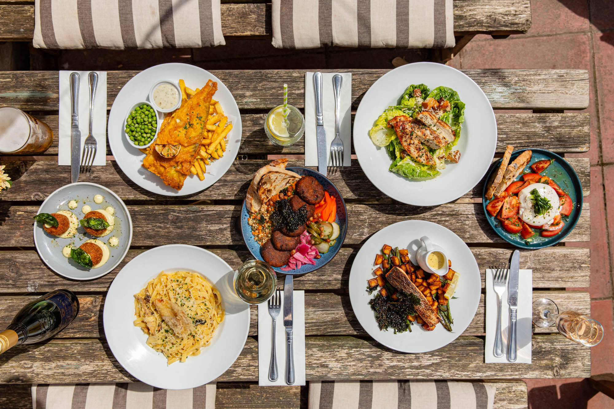 over head shot of the table in the garden laid out with lunch dishes