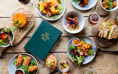 over head shot of the dishes served on brown table, the Better half. Brighton restaurants lunch guide. Gastro Pubs Brighton and Hove