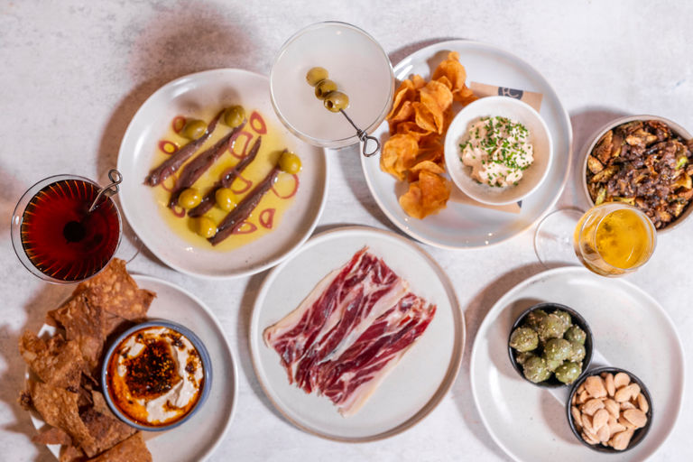 over head shot of the four small plates and drinks at Fourth and Church