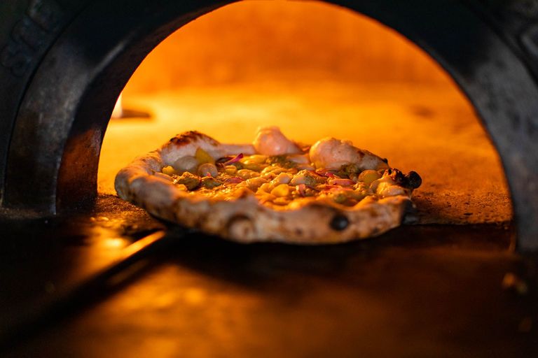 pizza in the indoor pizza oven, kids eat for free at Half Term