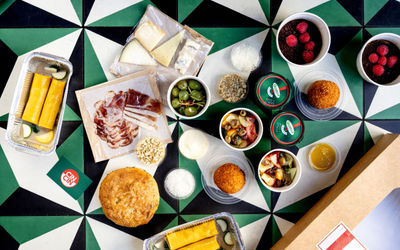 Finish at home meal takeaway packages from Italian restaurant Cin Cin. Ingredients all laid out on a geometric table.
