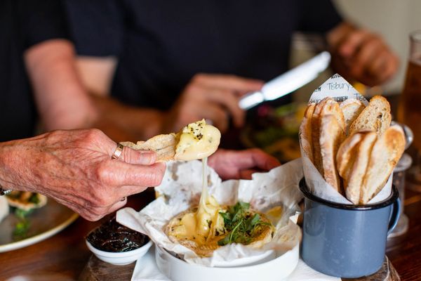 dipping piece of bread into melted cheese. A Fringe food guide favourite.