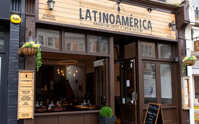 Exterior shot of the LatinoAmerica restaurant in Hove with its brown panelling. LatinoAmerica was voted among the best or top 20 Brighton restaurants at the 2023 Brighton Restaurant Awards Vote Online (BRAVOS). Renowned for some of the best steaks in the city and standout South American Wines.
