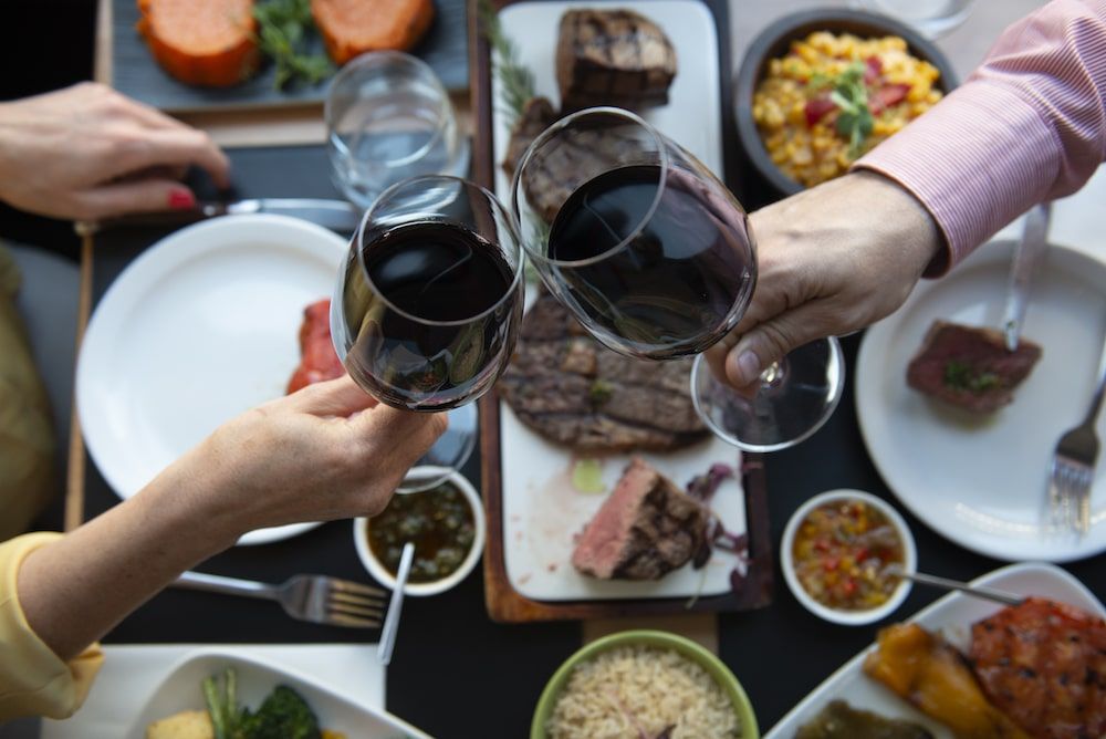 Cosy table setting inside LatinoAmerica restaurant in Brighton with wine glasses, cutlery, and warm ambient lighting. Romantic restaurants in Brighton.