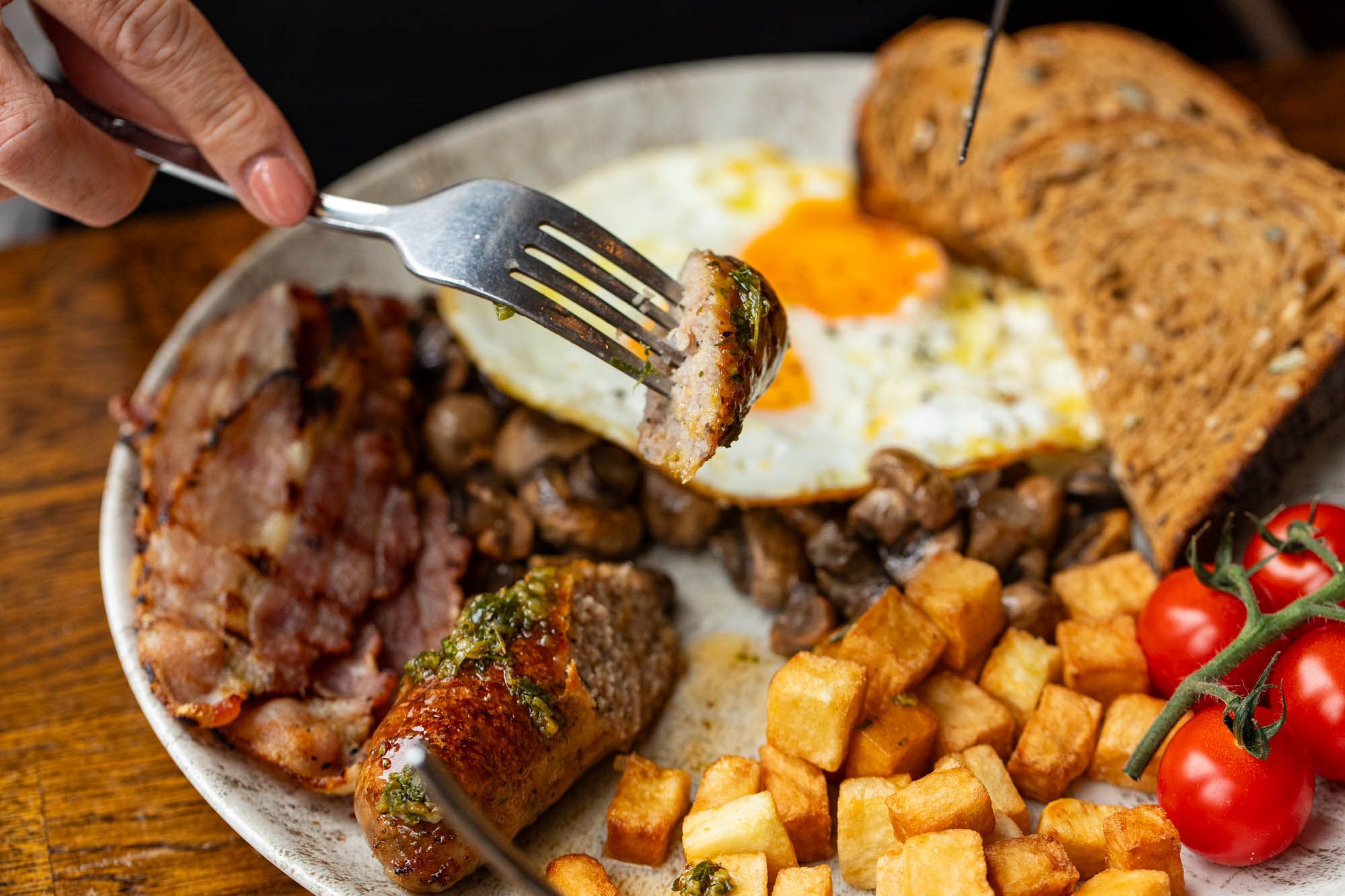 brunch at the LatinoAmerica in Hove, sausage, meat, bread, tomatoes and egg