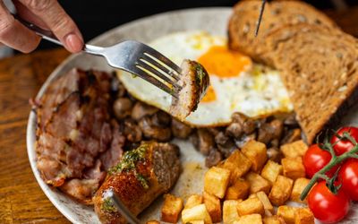 brunch at the LatinoAmerica in Hove, sausage, meat, bread, tomatoes and egg