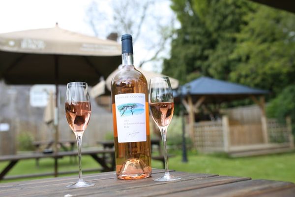 Garden and bottle of Rosé, Pubs in Sussex, Sussex beer garden