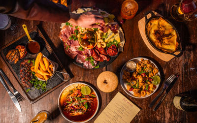over head shot of the table populated with 5 dishes at Bohemia Brighton