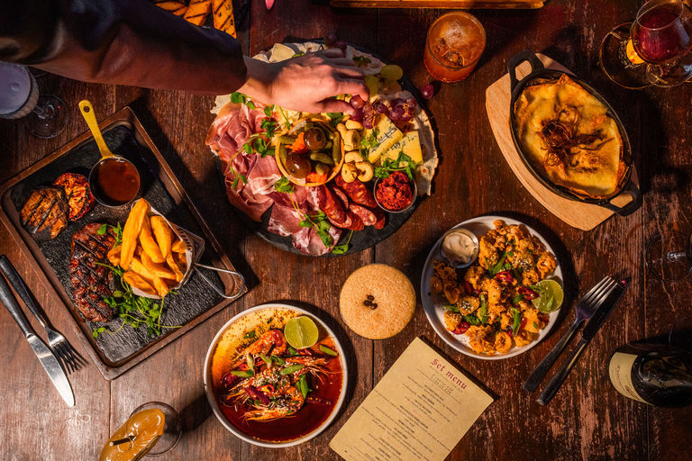over head shot of the table populated with 5 dishes at Bohemia Brighton