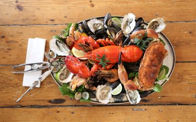 Lobster platter at the Copper Clam served on an oval tray with oysters, clams and musssels.