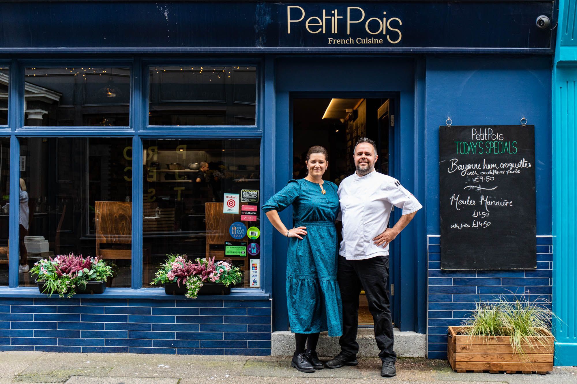 David and Ivana Roy at Petit Pois restaurant in Brighton. Stood outside the restaurant in Brighton's Lanes with the dark blue facade