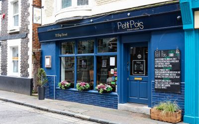 exterior shot of the blue building of petit pots