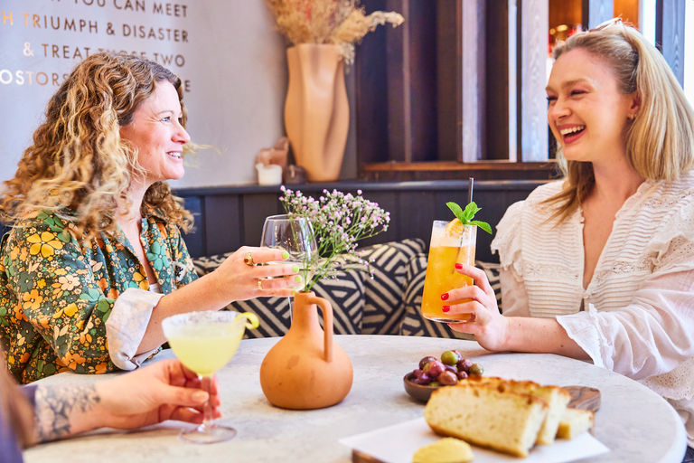 two girls having cocktails together. Hen party Brighton. Pictured at Lost in the Lanes.