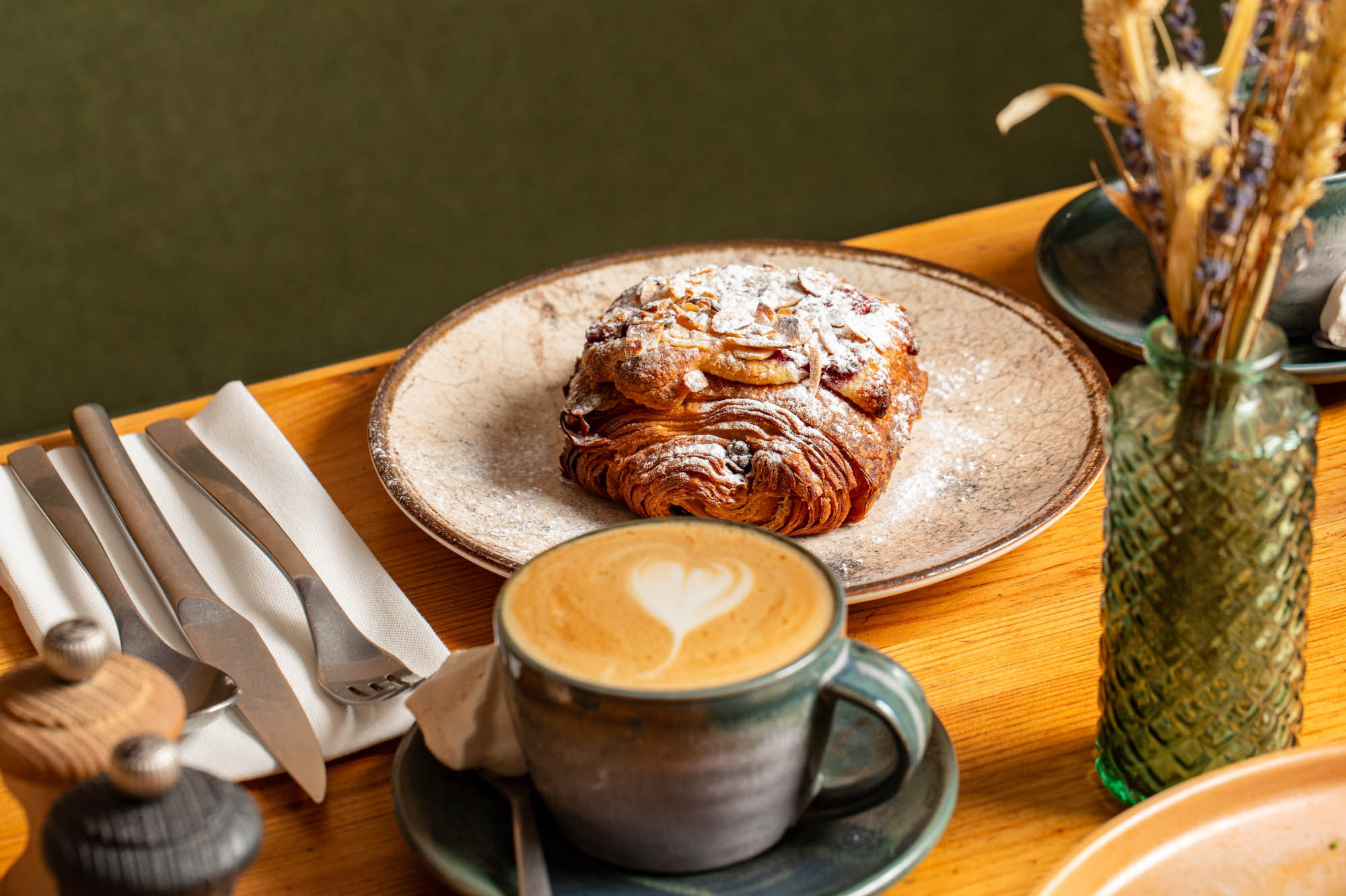 croissant and coffee served on the table at Mange Tout Brighton
