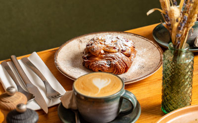 croissant and coffee served on the table at Mange Tout Brighton