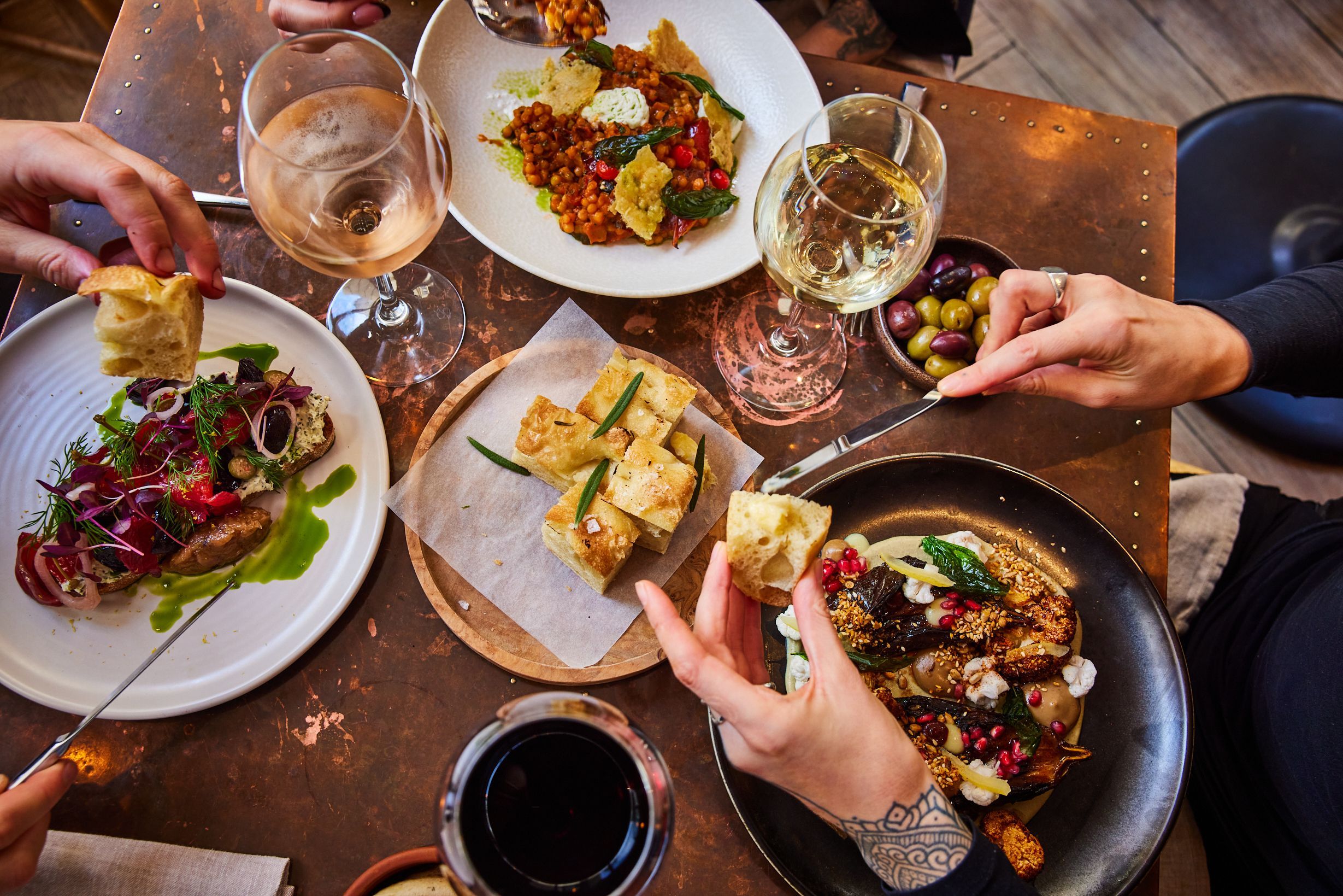 over head shot of the people enjoying their lunch at the lost in the lanes. Romantic Restaurants Brighton. Part of our round up of Places to eat in Brighton