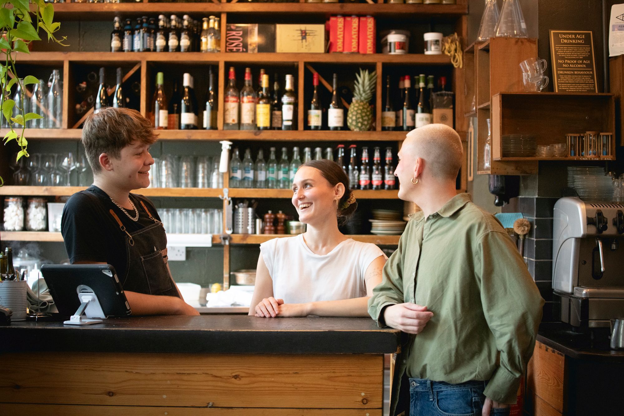 mange tout staff smiling and talking to each other