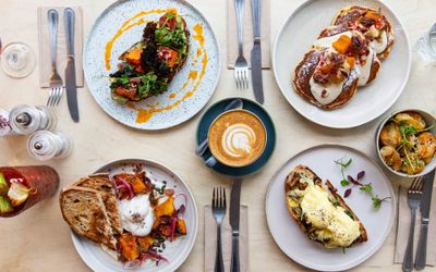 over head shot of the table laid out with brunch dishes including egg on toast, pancakes, potatoes at sides. Starfish and Coffee