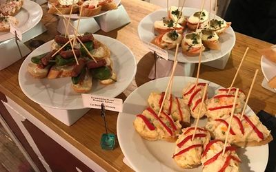 A selection of different pinchos served on white plates