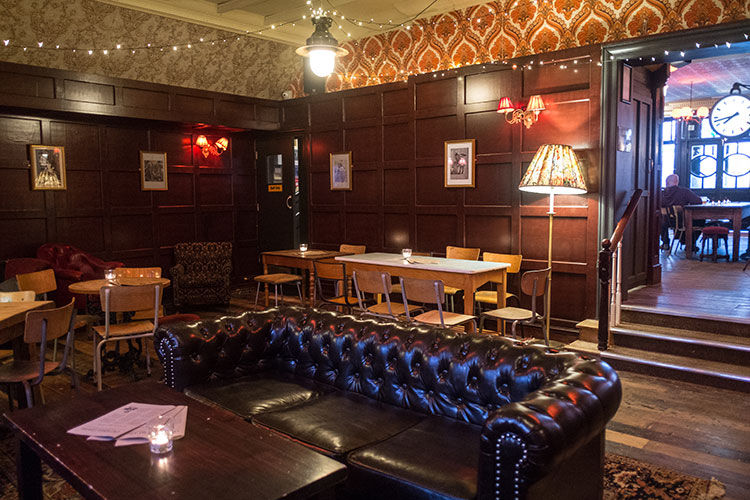 pubs with fires, sofa and interior at Hove pub