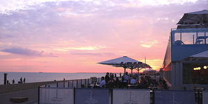 Alfresco dining with a beach sunset at West Beach Bar & Kitchen