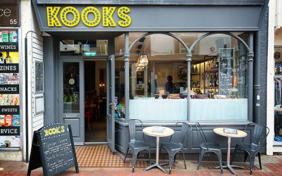 Exterior of Kooks Brighton with outside seating on the street.