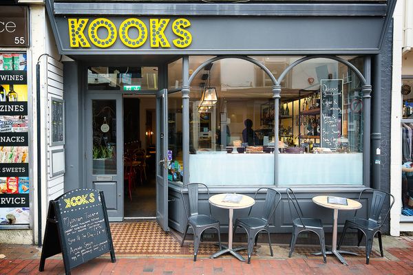 Exterior of Kooks Brighton with outside seating on the street.