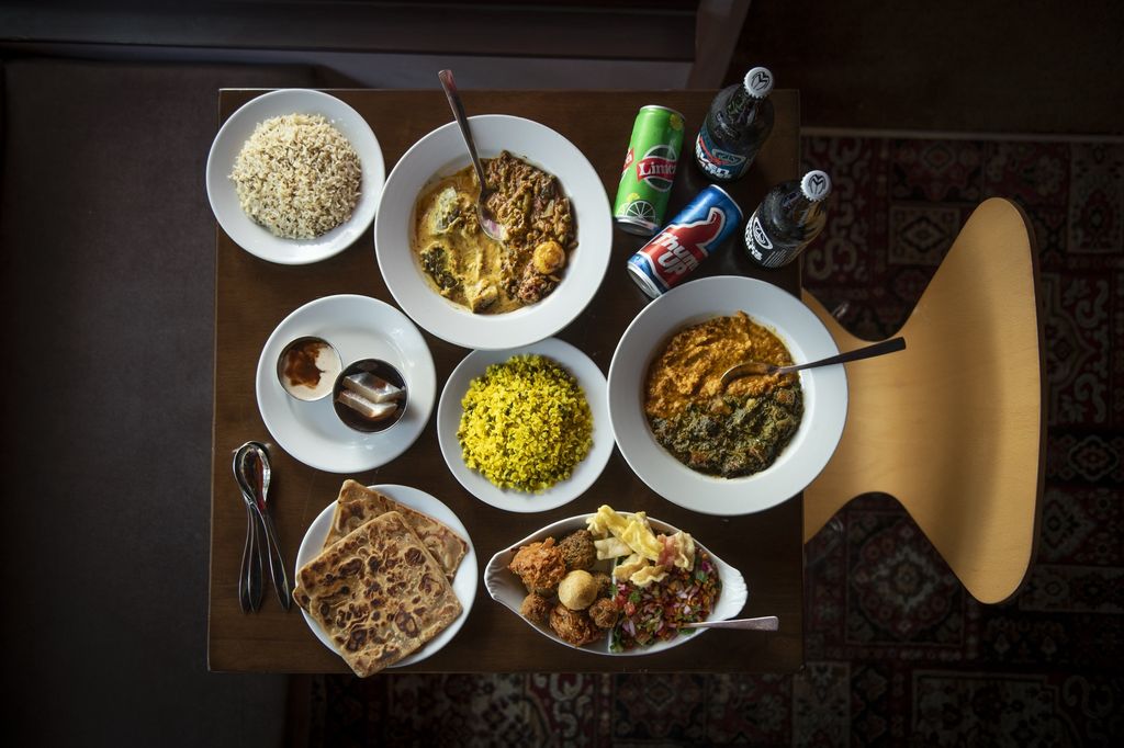 A table covered in Indian food 