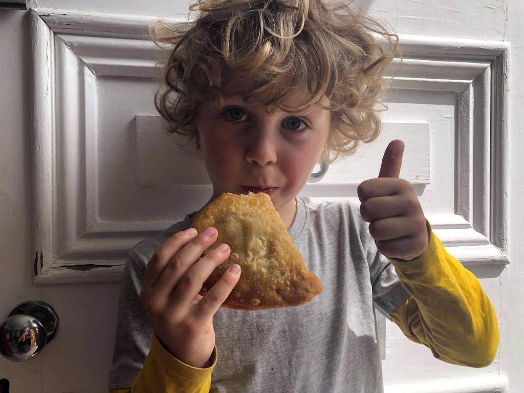 Boy with a samosa 