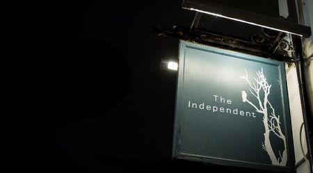 The Independent outside sign at night