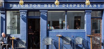 Blue painted Brighton Beer Dispensary exterior on a sunny day