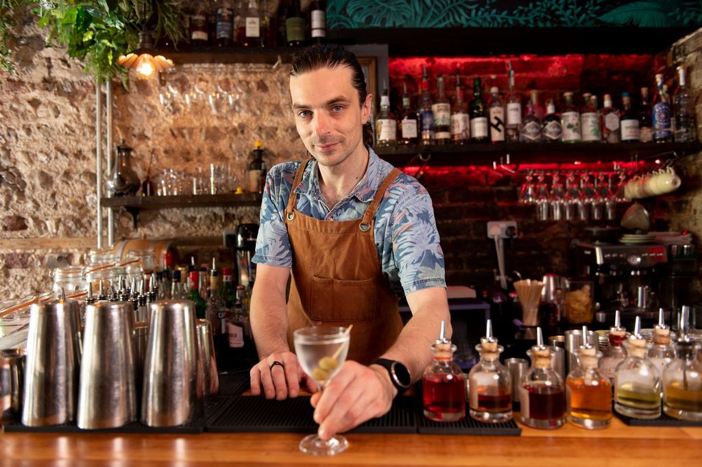 gungho bartender with cocktail in hand