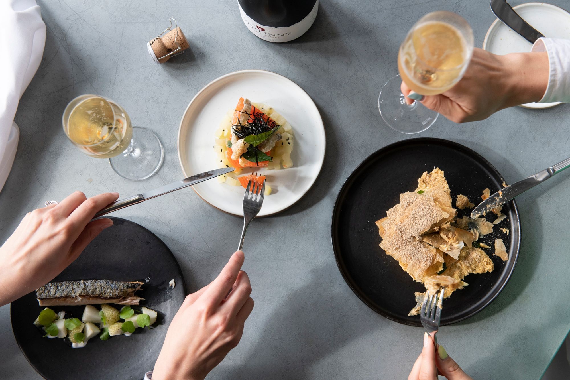 overhead shot of the two people eating by the table