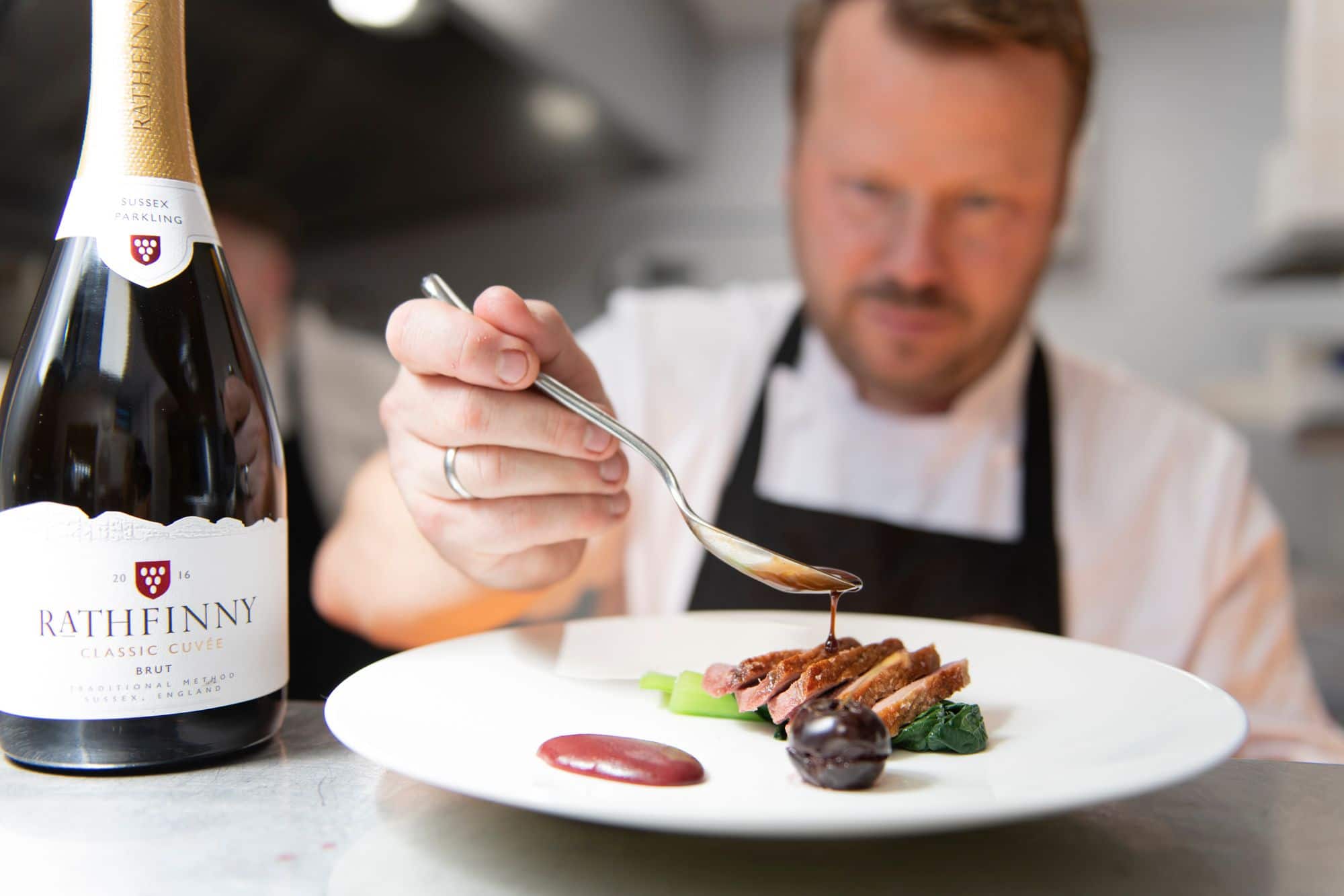 chef finishing dish with decoration