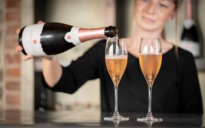 bartender pouring sparkling wine. Valentine's Day in Brighton. Picture is taken at Rathfinny wine estate.